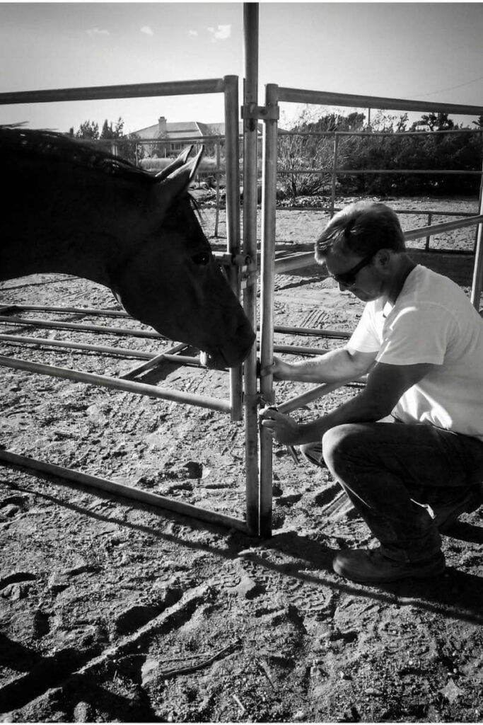 Jeremy Wilson, Oak Hills Realtor, maintaining horse fencing at his personal ranch in the High Desert.